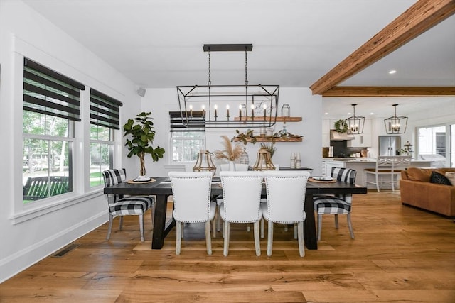 30 Indian Cove Rd, Marion, MA 02738 - dining room with a chandelier, light wood finished floors, beam ceiling, and baseboards