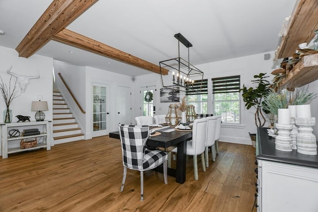 30 Indian Cove Rd, Marion, MA 02738 - dining space with stairway, wood finished floors, beam ceiling, plenty of natural light, and a chandelier