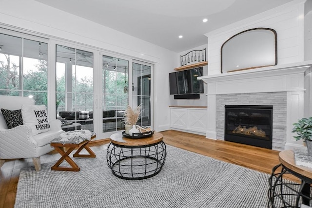 30 Indian Cove Rd, Marion, MA 02738 - living room featuring wood finished floors, recessed lighting, and a tiled fireplace