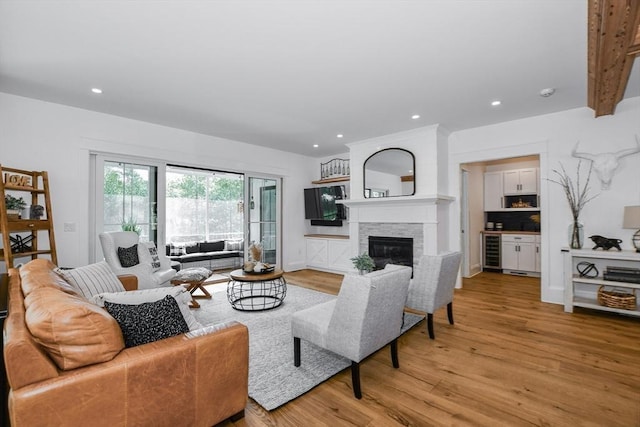 30 Indian Cove Rd, Marion, MA 02738 - living area featuring wine cooler, light wood-type flooring, a fireplace, and recessed lighting