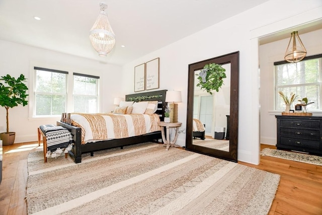 30 Indian Cove Rd, Marion, MA 02738 - bedroom featuring wood finished floors, a chandelier, baseboards, and recessed lighting