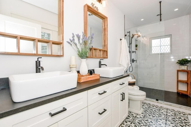 30 Indian Cove Rd, Marion, MA 02738 - bathroom with toilet, walk in shower, double vanity, recessed lighting, and tile patterned flooring
