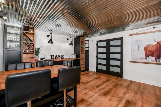 30 Indian Cove Rd, Marion, MA 02738 - bar area with baseboards and wood finished floors