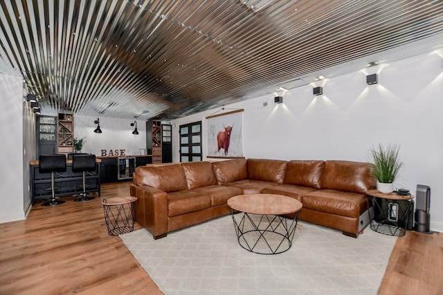 30 Indian Cove Rd, Marion, MA 02738 - living area featuring bar, light wood-style flooring, and baseboards