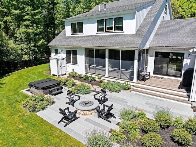 30 Indian Cove Rd, Marion, MA 02738 - back of house with an outdoor fire pit, a hot tub, a wooden deck, roof with shingles, and a patio area