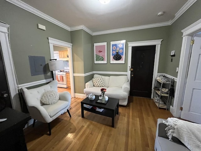 living room with wood-type flooring, electric panel, and crown molding