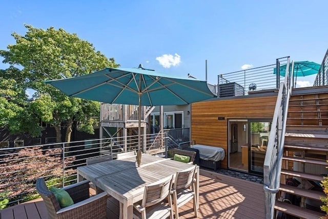 288 Marginal St Unit 4, Boston, MA 02128 - wooden deck with outdoor dining space