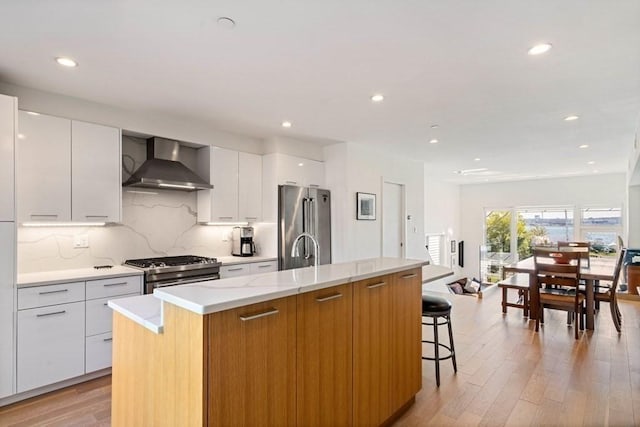 288 Marginal St Unit 4, Boston, MA 02128 - kitchen with high end appliances, modern cabinets, wall chimney range hood, a center island with sink, and recessed lighting