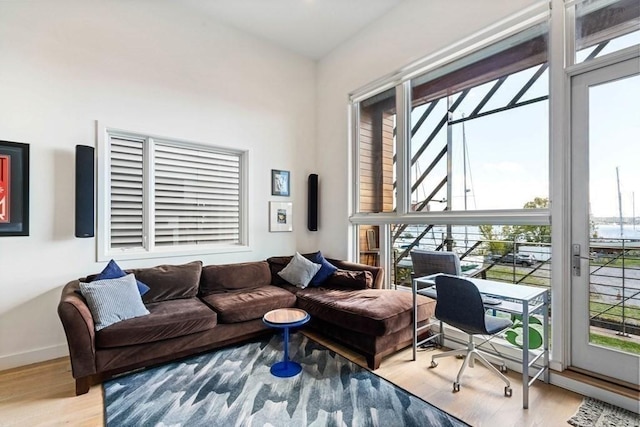 288 Marginal St Unit 4, Boston, MA 02128 - living room with plenty of natural light, wood finished floors, baseboards, and a desk