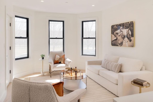 living room featuring recessed lighting and baseboards