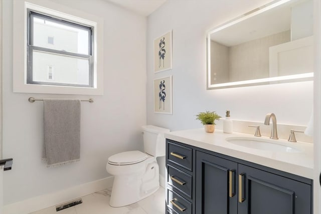 bathroom featuring visible vents, toilet, marble finish floor, baseboards, and vanity