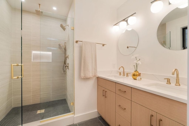 full bathroom with a sink, a stall shower, double vanity, and tile patterned floors