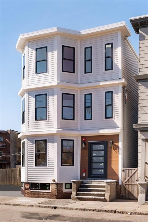 view of front of house with fence