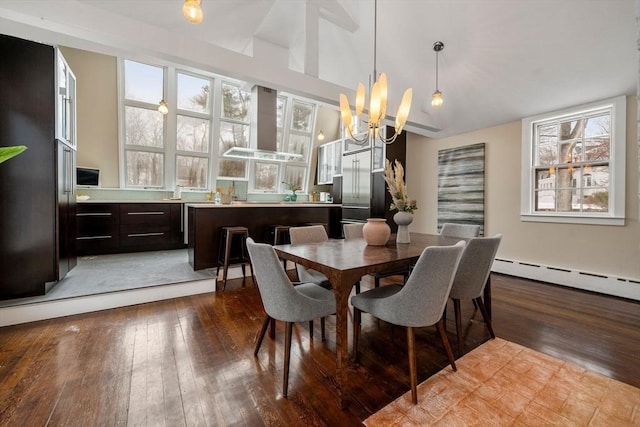 dining area featuring lofted ceiling, an inviting chandelier, a baseboard radiator, and light wood-style flooring