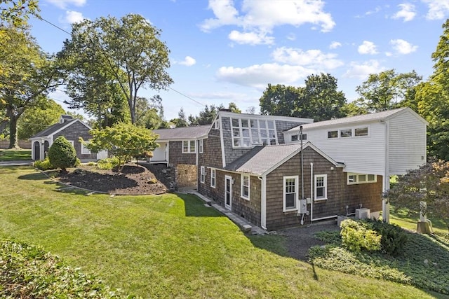 back of house featuring a yard