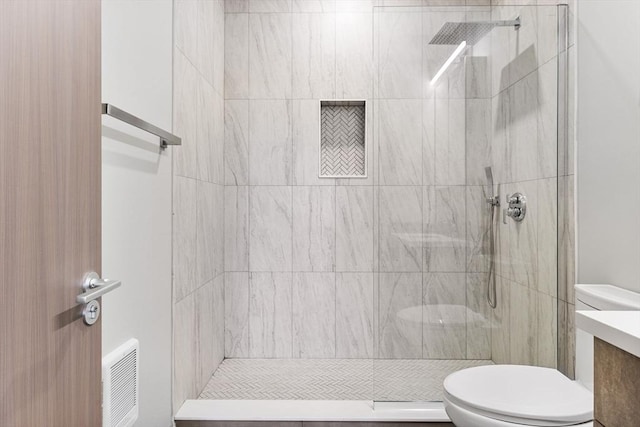 43-47 Fremont Unit 7, Boston, MA 02126 - bathroom featuring vanity, a tile shower, toilet, and visible vents
