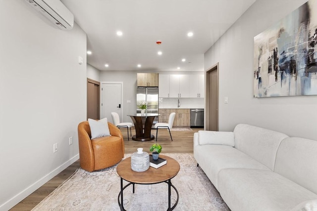 43-47 Fremont Unit 7, Boston, MA 02126 - living room with light wood-type flooring, recessed lighting, baseboards, and a wall mounted AC