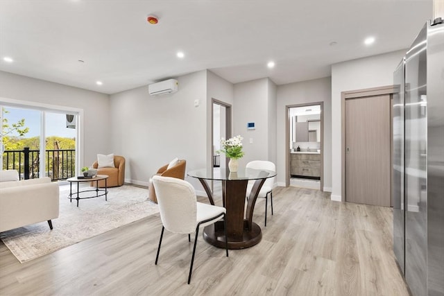 43-47 Fremont Unit 7, Boston, MA 02126 - dining space featuring recessed lighting, baseboards, light wood-style flooring, and a wall mounted air conditioner