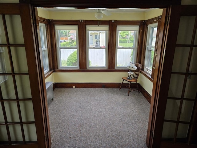 43 Jefferson St, Taunton, MA 02780 - unfurnished sunroom with carpet floors, plenty of natural light, and baseboards
