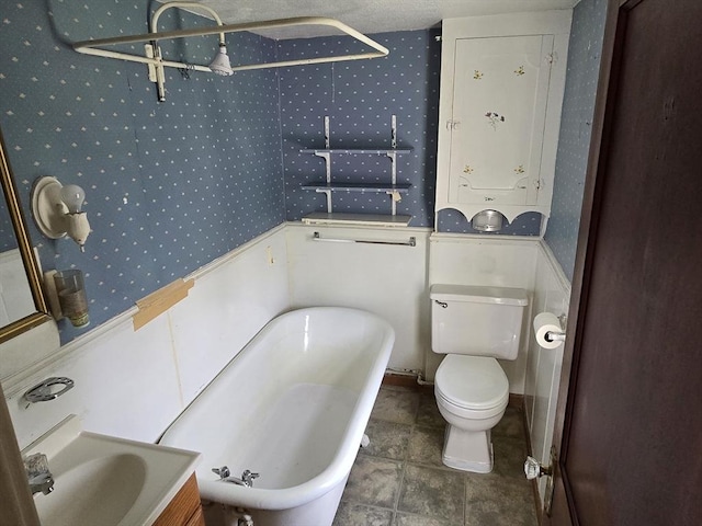 43 Jefferson St, Taunton, MA 02780 - full bath with a soaking tub, toilet, wallpapered walls, and vanity