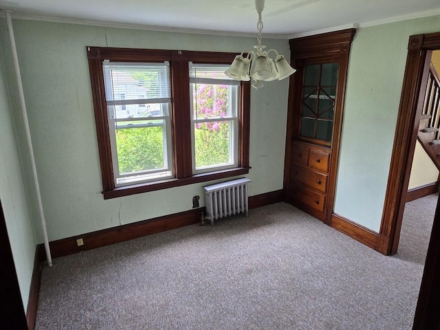 43 Jefferson St, Taunton, MA 02780 - unfurnished dining area with radiator, a chandelier, carpet floors, crown molding, and baseboards