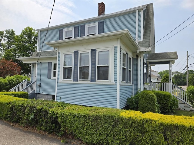 43 Jefferson St, Taunton, MA 02780 - view of property exterior featuring a chimney and stairway