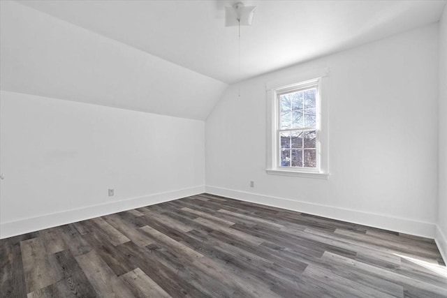 bonus room featuring lofted ceiling and dark hardwood / wood-style flooring