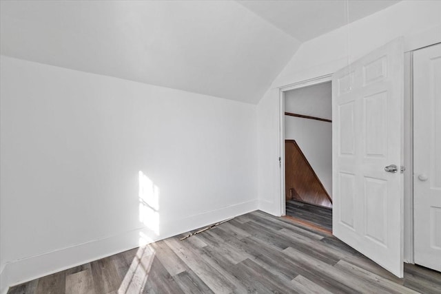 bonus room featuring hardwood / wood-style flooring and vaulted ceiling