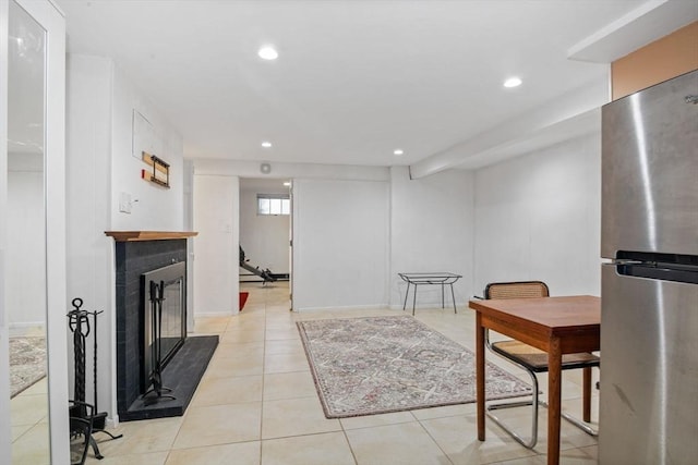 304 Hunting Rd, Needham, MA 02494 - dining room featuring a glass covered fireplace, light tile patterned floors, and recessed lighting