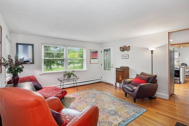304 Hunting Rd, Needham, MA 02494 - living room featuring baseboard heating and wood finished floors