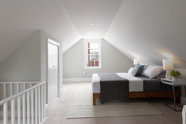 carpeted bedroom featuring vaulted ceiling