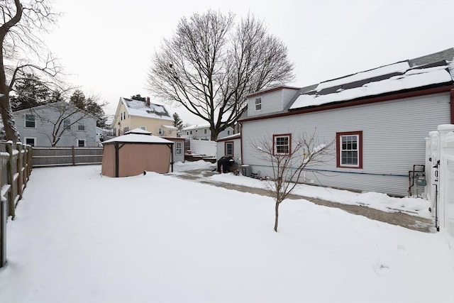 snowy yard featuring a gazebo