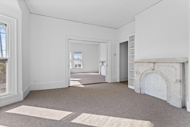 unfurnished living room featuring carpet floors