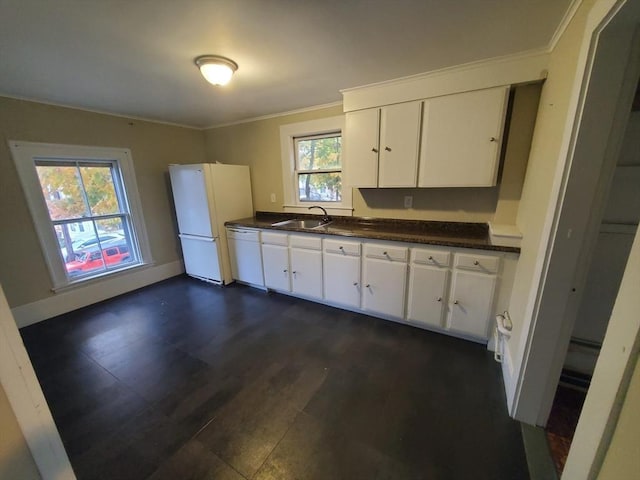 kitchen featuring white cabinetry, white appliances, ornamental molding, and sink