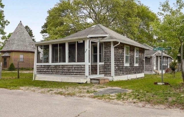 7 Crescent Pl, Wareham, MA 02558 - view of side of home featuring a sunroom and a shingled roof