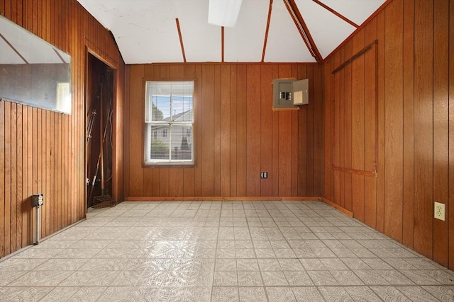 7 Crescent Pl, Wareham, MA 02558 - empty room featuring light flooring, lofted ceiling, electric panel, and wood walls