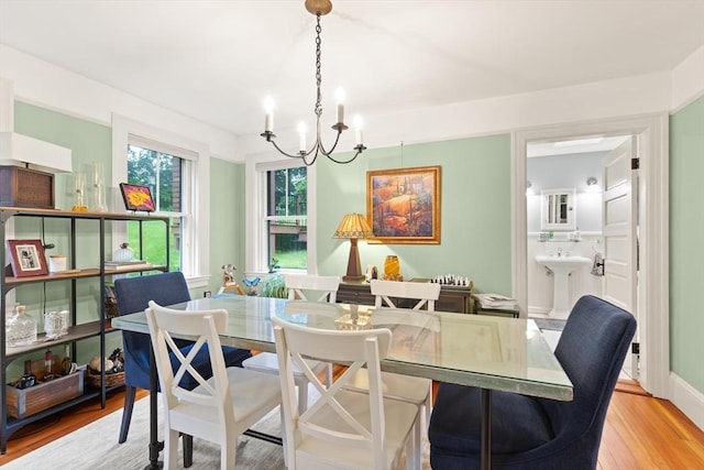 965 Greenville Ave, Smithfield, RI 02828 - dining area with a chandelier and light wood-style floors