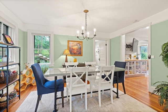 965 Greenville Ave, Smithfield, RI 02828 - dining area featuring a chandelier, light wood finished floors, and plenty of natural light