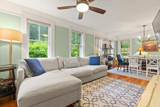 965 Greenville Ave, Smithfield, RI 02828 - living room featuring wood finished floors, a ceiling fan, and a chandelier