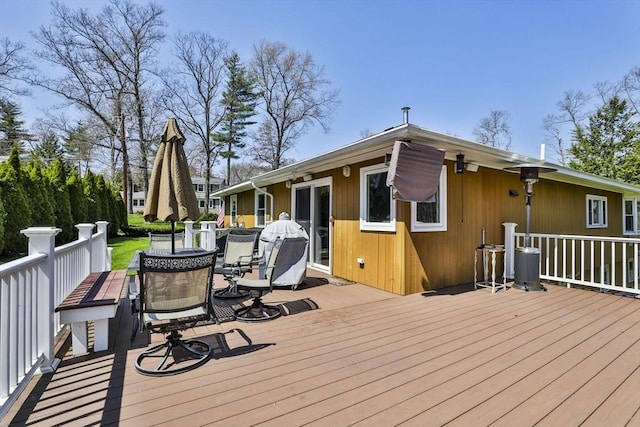 wooden terrace featuring outdoor dining area