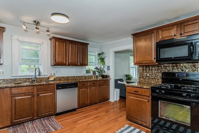 15 Ryan Rd, Northampton, MA 01062 - kitchen featuring black appliances, a sink, dark stone counters, light wood-style floors, and ornamental molding