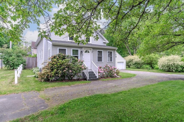 15 Ryan Rd, Northampton, MA 01062 - view of front of house with driveway, a garage, and entry steps