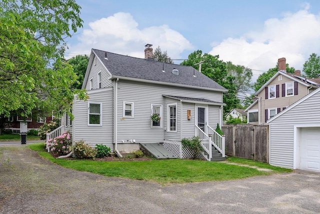 15 Ryan Rd, Northampton, MA 01062 - rear view of house with a chimney and roof with shingles