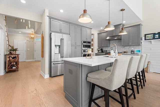 27 Richardson Dr Unit 27, Millis, MA 02054 - kitchen featuring appliances with stainless steel finishes, gray cabinets, light wood-style flooring, and recessed lighting