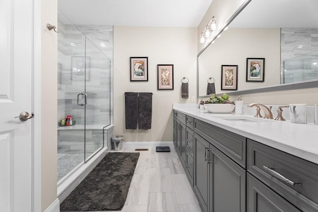27 Richardson Dr Unit 27, Millis, MA 02054 - bathroom with double vanity, a stall shower, and marble look tiles