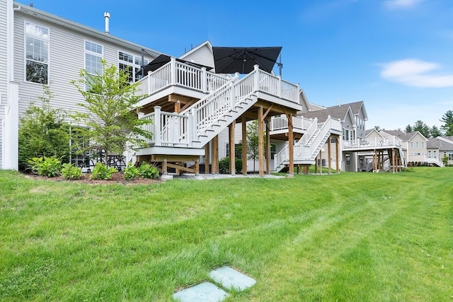 27 Richardson Dr Unit 27, Millis, MA 02054 - back of house with stairs, a wooden deck, and a yard
