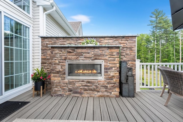 27 Richardson Dr Unit 27, Millis, MA 02054 - wooden deck with an outdoor stone fireplace