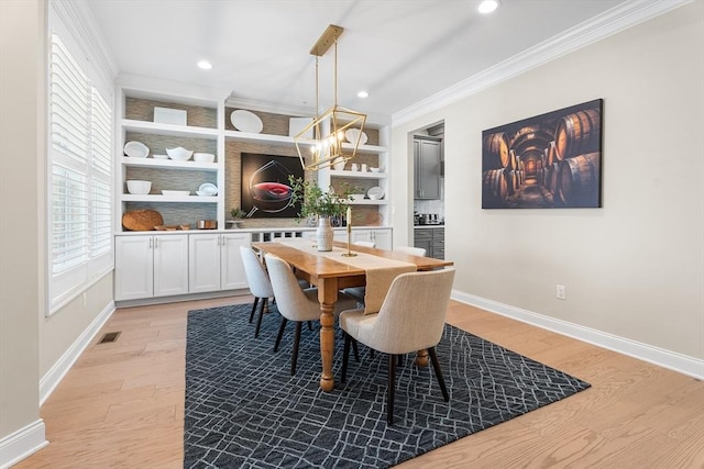 27 Richardson Dr Unit 27, Millis, MA 02054 - dining room featuring ornamental molding, a chandelier, light wood-style flooring, recessed lighting, and built in shelves