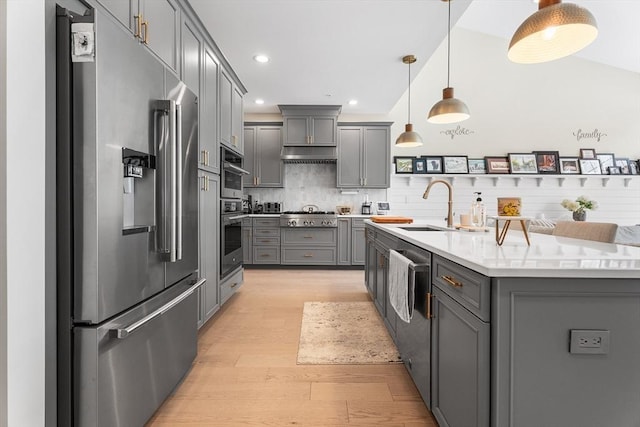 27 Richardson Dr Unit 27, Millis, MA 02054 - kitchen featuring appliances with stainless steel finishes, gray cabinetry, light wood-type flooring, light countertops, and tasteful backsplash