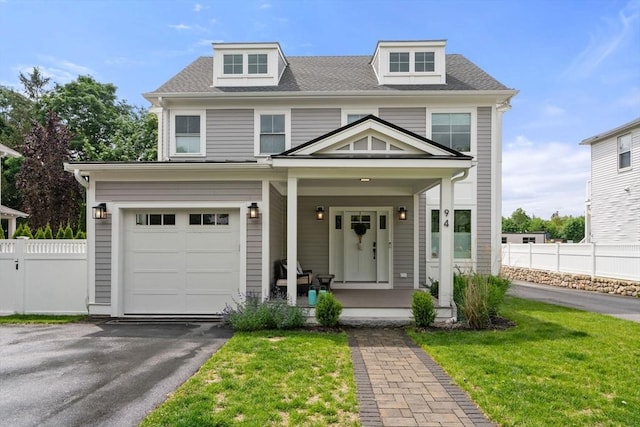 94 Webster Unit 94, Newton, MA 02465 - view of front of house featuring covered porch, a garage, asphalt driveway, and a shingled roof